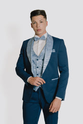 Abito blu con Reverse  e gilet damascato celeste